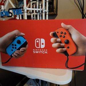 NWT, Nintendo switch with Mario cart game. Both un-opened  never played with.